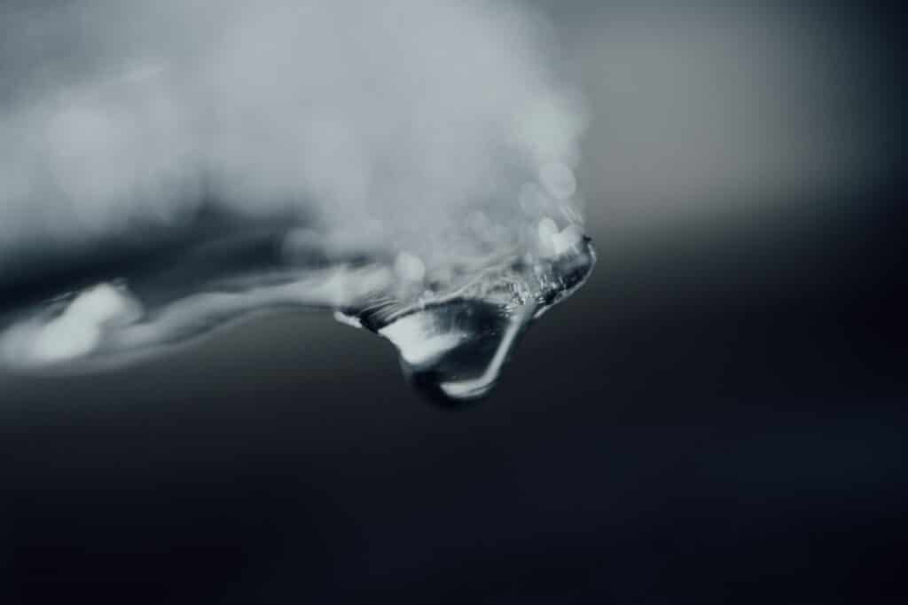 water splash in grayscale photography