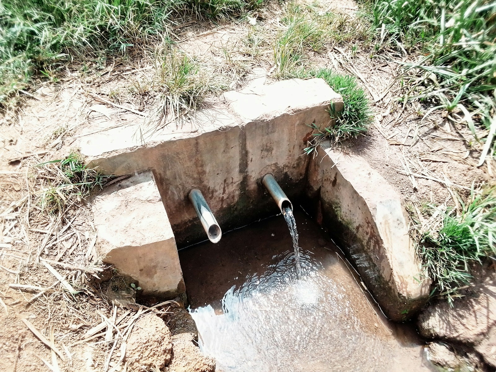 a water drainage pipe in a ditch Sewer lines and sewer systems