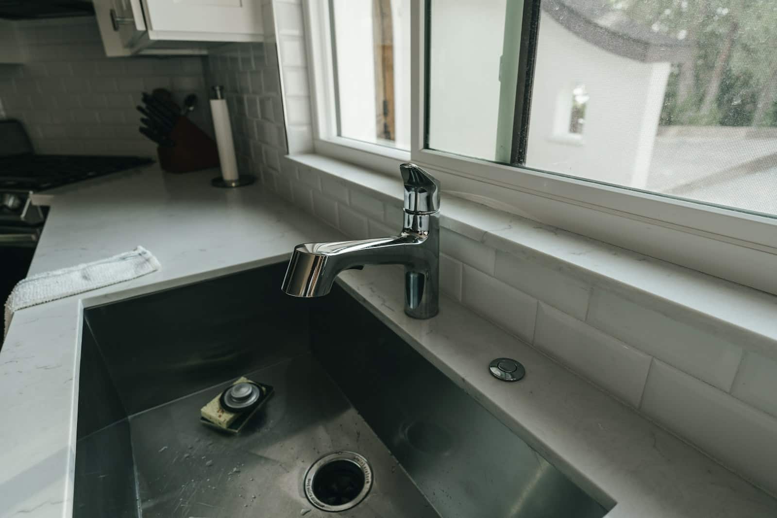 a sink with a faucet residential plumbing