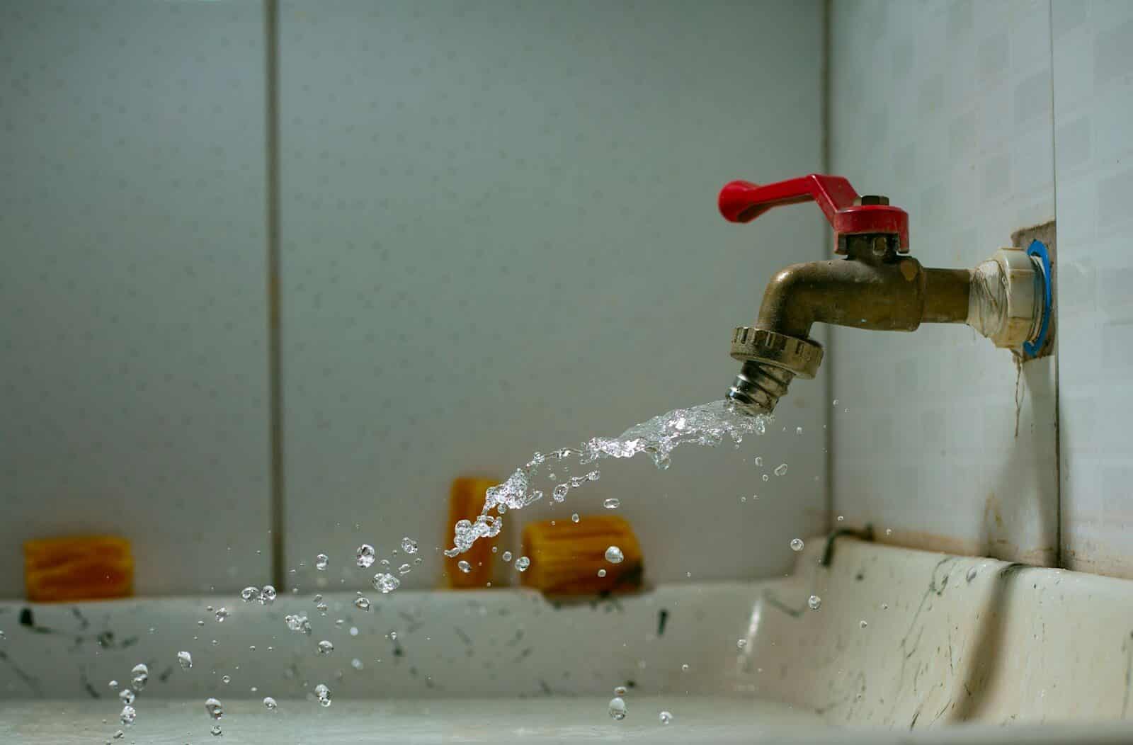 Photo by Ian Talmacs a faucet running water Plumber in Prince Frederick Maryland: Prompt Professional Plumbing Care